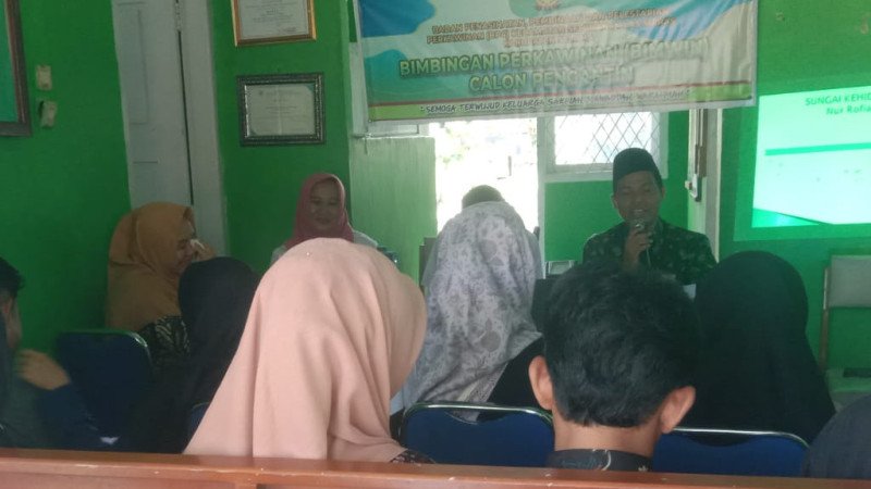 KUA SAM Laksanakan BIMWIN Terpadu Angkatan II Dihadiri Puskesmas Kembang Mumpo & PLKB Semidang Alas Maras