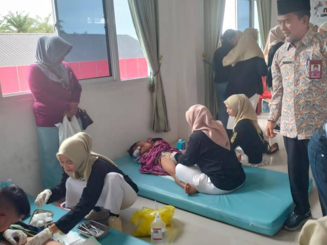 Sinergi Lintas Sektor, Kepala KUA Hadiri Peringatan HKN ke-61 di Puskesmas Tanah Putih I