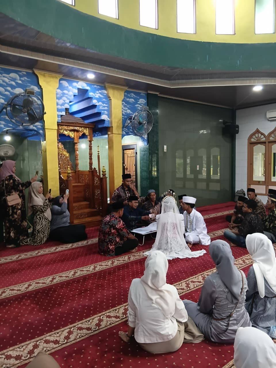 Hujan Tak Halangi Tugas, Ka. KUA Pancur Batu Beri Teladan Pelayanan Prima