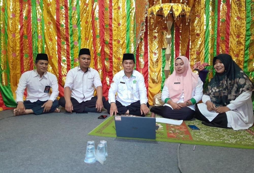 Ikuti Kegiatan Zoom Meeting, KUA Kecamatan Kuantan Hilir Seberang Komitmen Dukung Program Kemenag RI