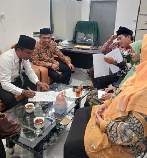 Gandeng SMAN 9 Mandau, Kepala KUA Kec. Mandau Tanda Tangani MoU BRUS