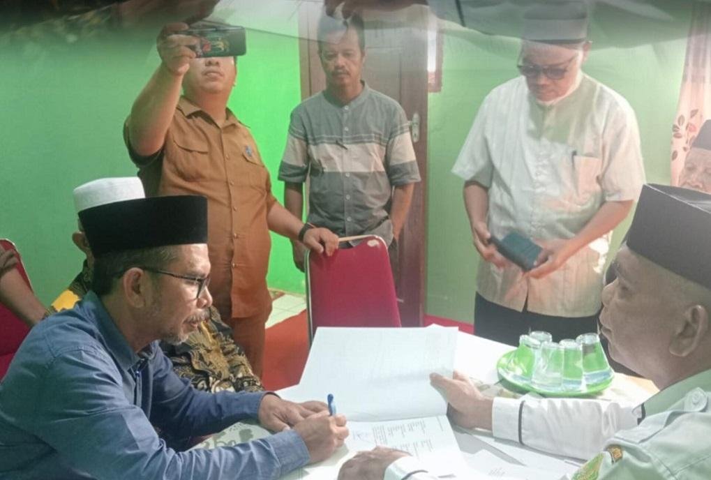 Ka. KUA Kampar Utara Tandatangani AIW untuk Pimpinan Ranting Muhammadiyah Naga Beralih