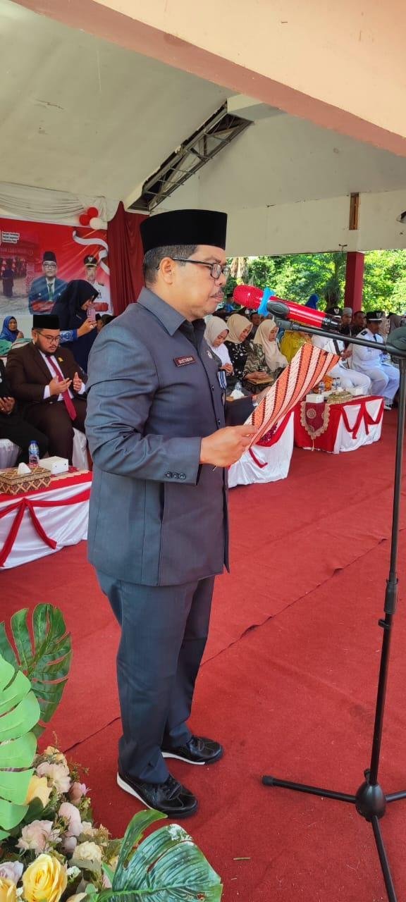 Ka. KUA Rambah Pimpin Doa pada Upacara HUT ke-80 RI Tingkat Kecamatan Rambah